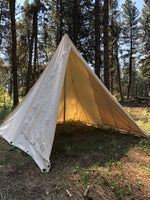 canvas tent in mountains 